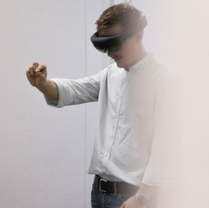 A person is working with a virtual reality visor